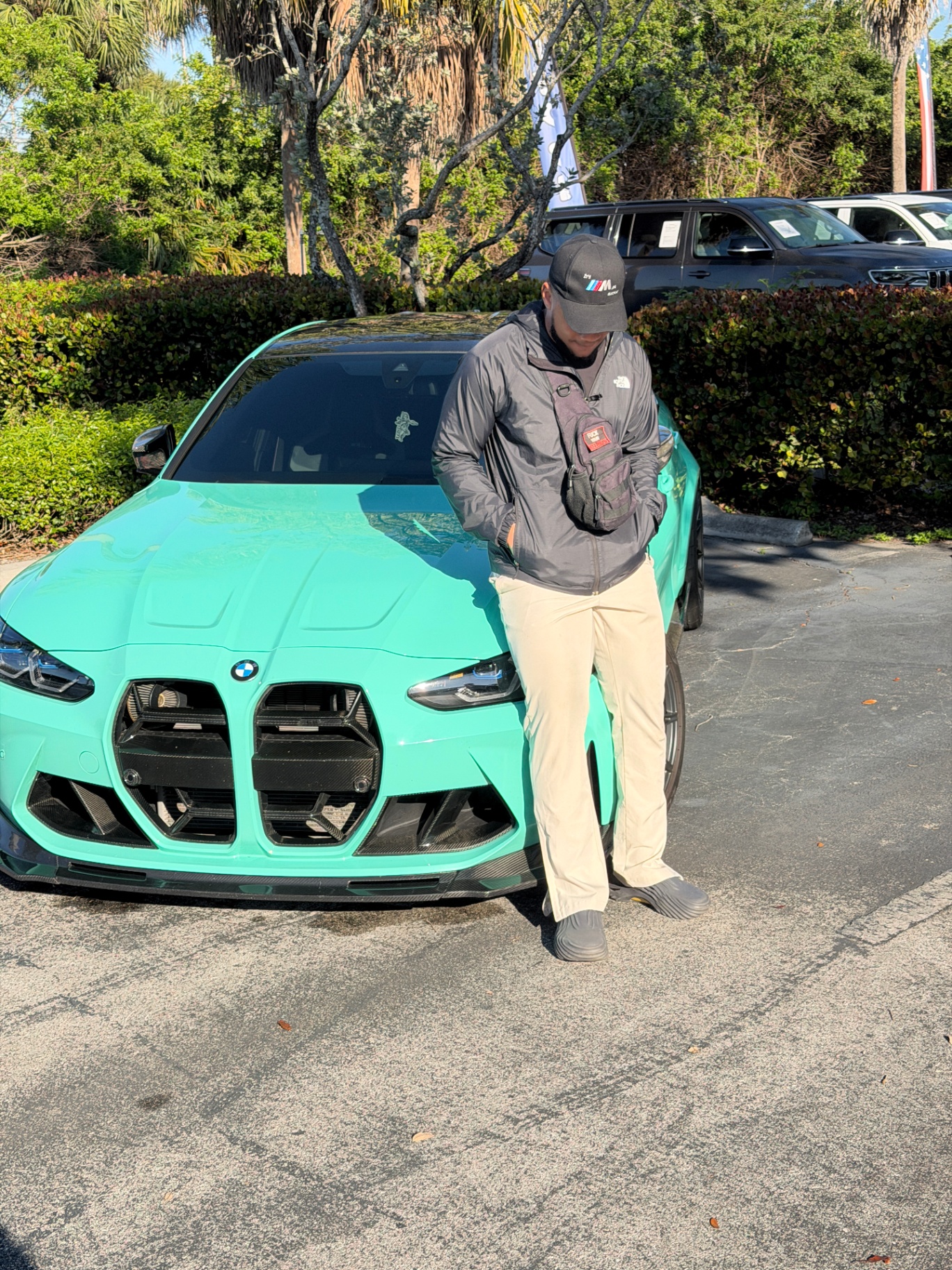 Taequez Davis standing with his BMW M4